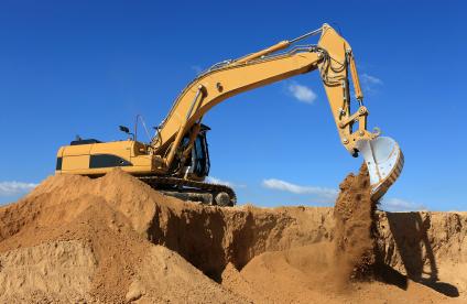 Construction equipment dumping earth 