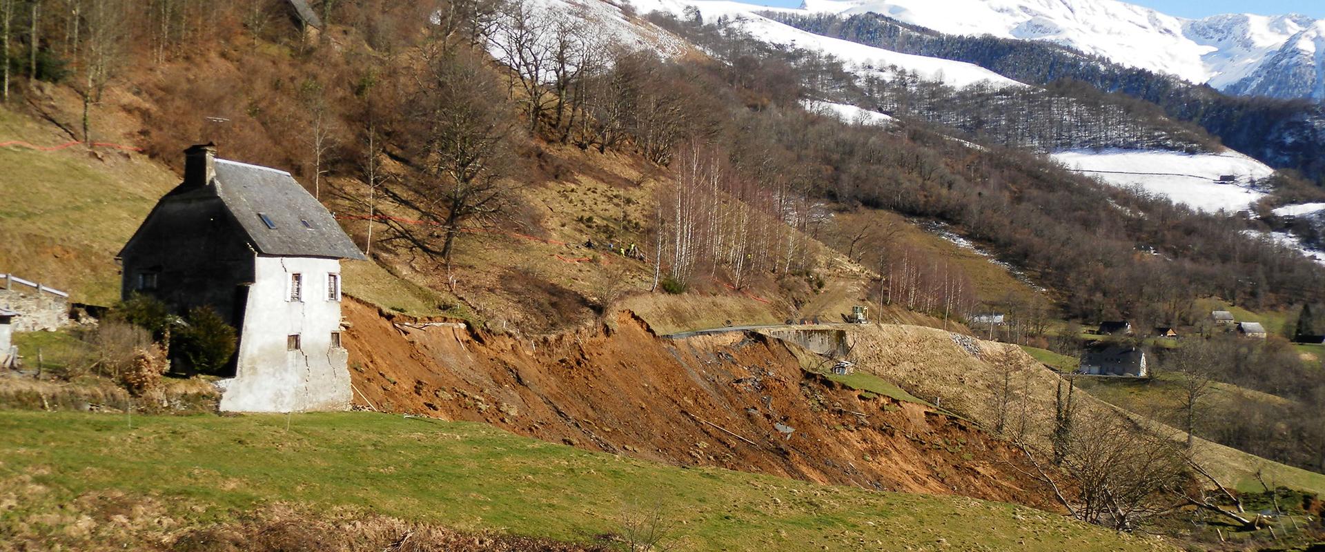 A mountain road and house destroyed by a landslip near Gazost, Midi-Pyrénées