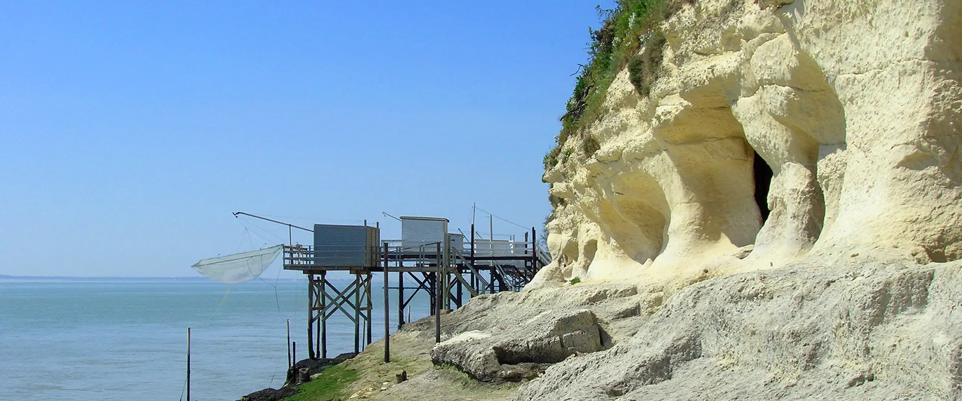 These cliff caves are karstic cavities from which Upper Cretaceous limestone was quarried in underground workings, Charente-Maritime