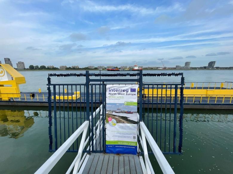 Suricates project banner set up near a site that has been reusing 200,000 tonnes of sediment from the navigation channel of the Port of Rotterdam (Rotterdam, 2022).